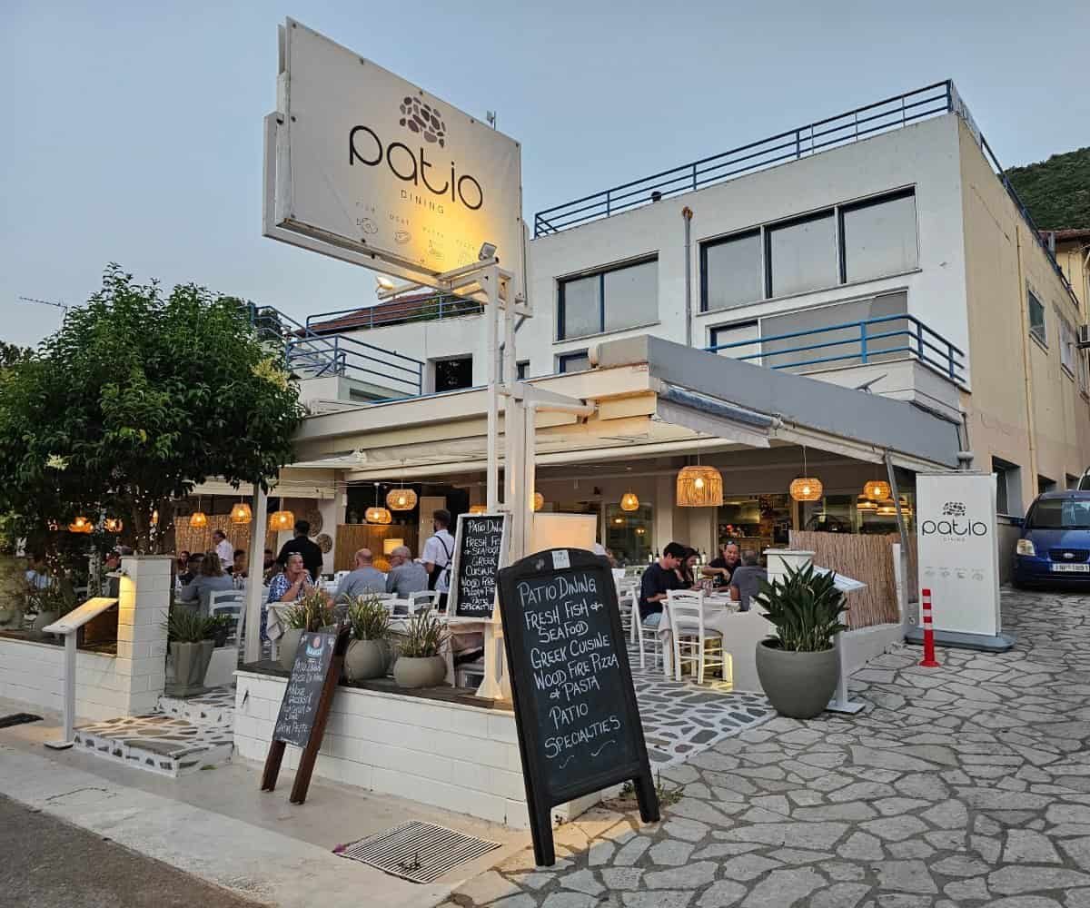 Patio Dining restaurant entrance and terrace in Vasiliki, Lefkada at dusk